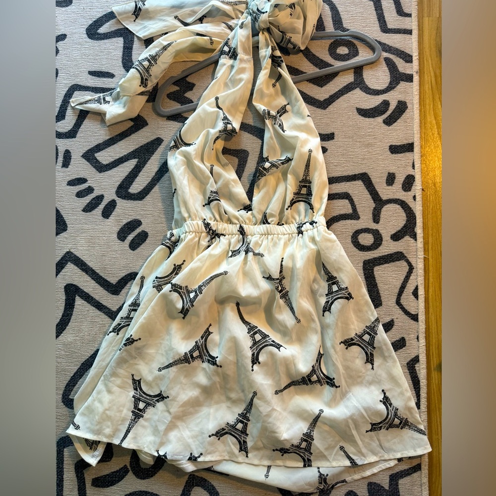 Halter top off white dress with eiffel tower print on it.